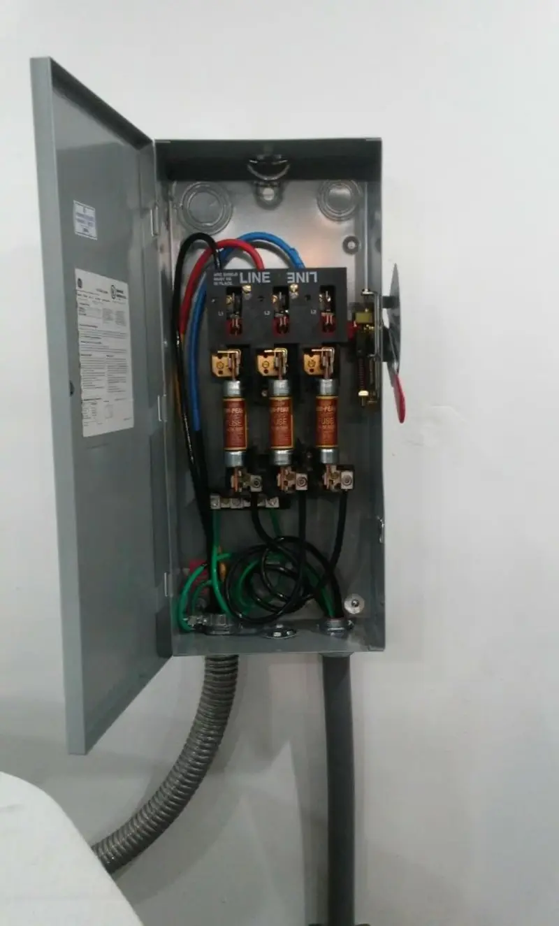 Three-phase disconnect switch installed for Smoke Detector Installation in Manor